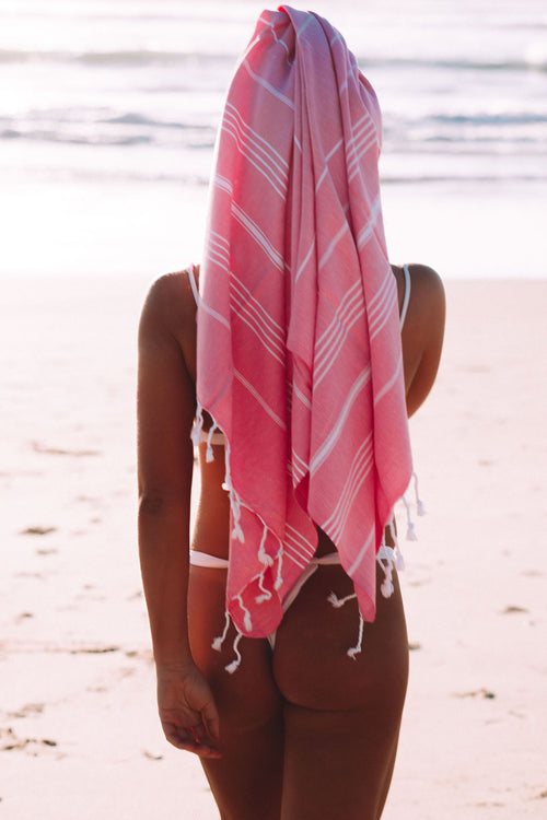 girl with pink towel on her head